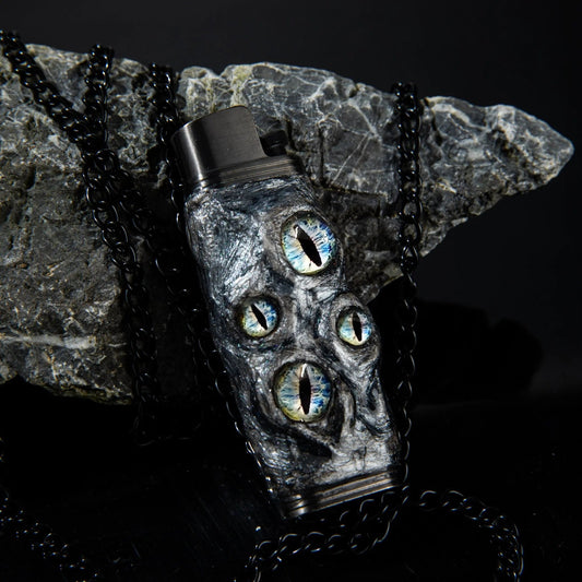 Unique Mellow Sora lighter case with dragon eye design, black chain, and stone background.