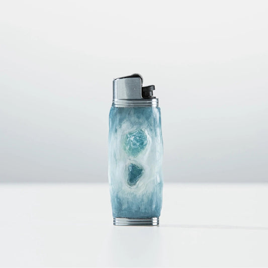 Mellow Sora blue textured lighter case with gemstone accents on white background