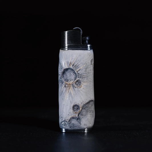 Mellow Sora moon-inspired lighter case with crater designs on a dark background