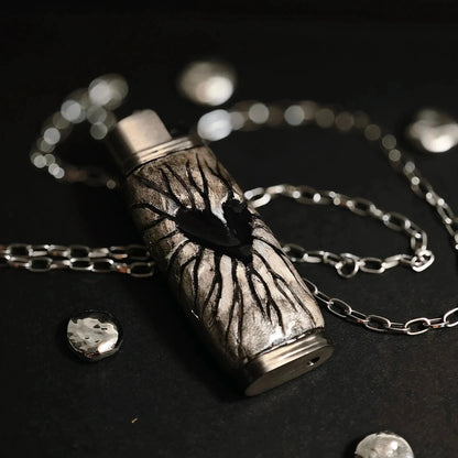 Mellow Sora heart design metal lighter case with chain on black background