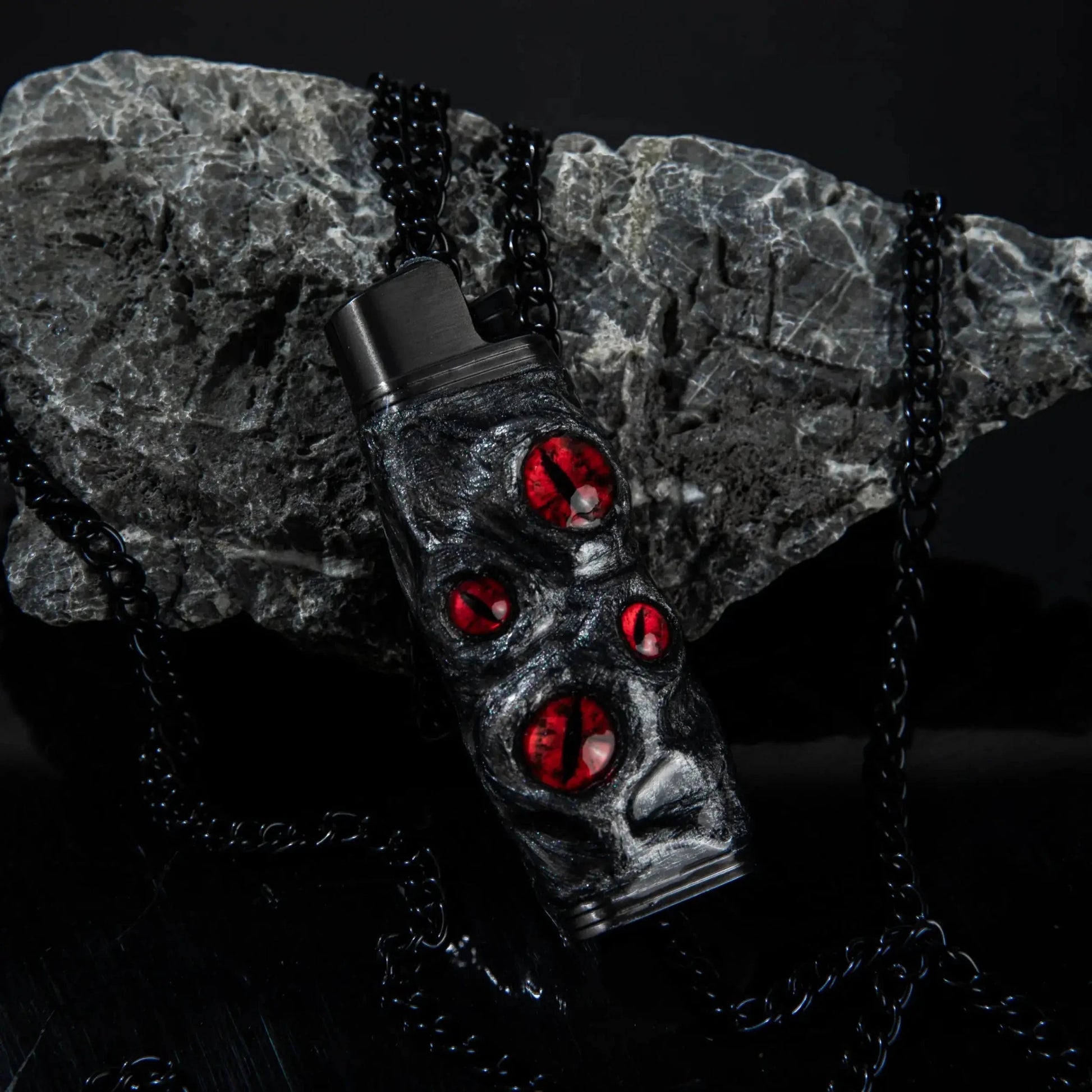 Mellow Sora black lighter case with red gem accents on dark stone background