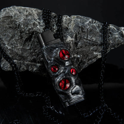 Mellow Sora black lighter case with red gem accents on dark stone background