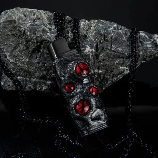 Mellow Sora black lighter case with red gem accents on dark stone background