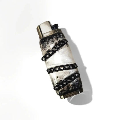 Mellow Sora lighter case with black chain wrap and distressed finish on white background