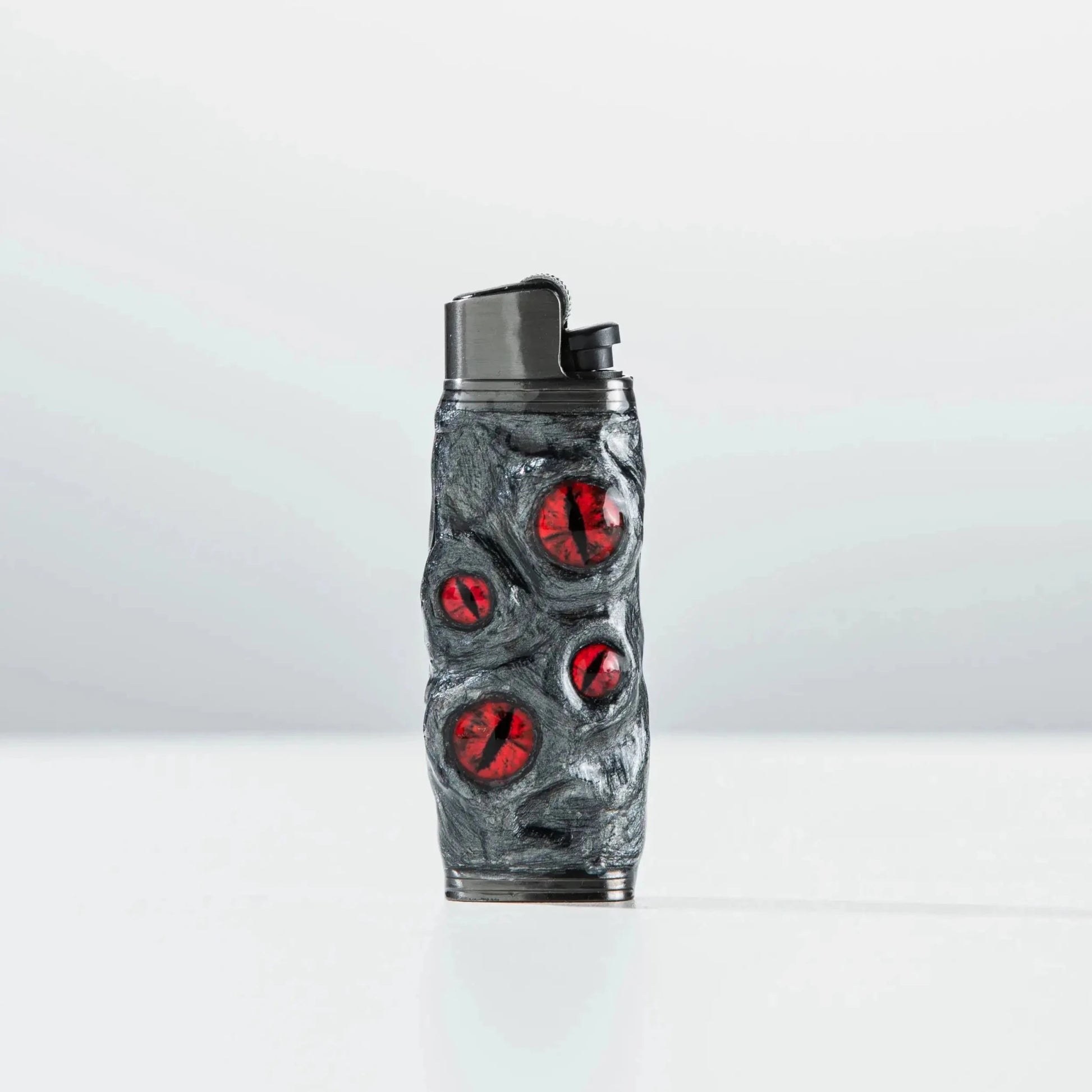 Unique Mellow Sora lighter case with textured gray surface and red gem accents